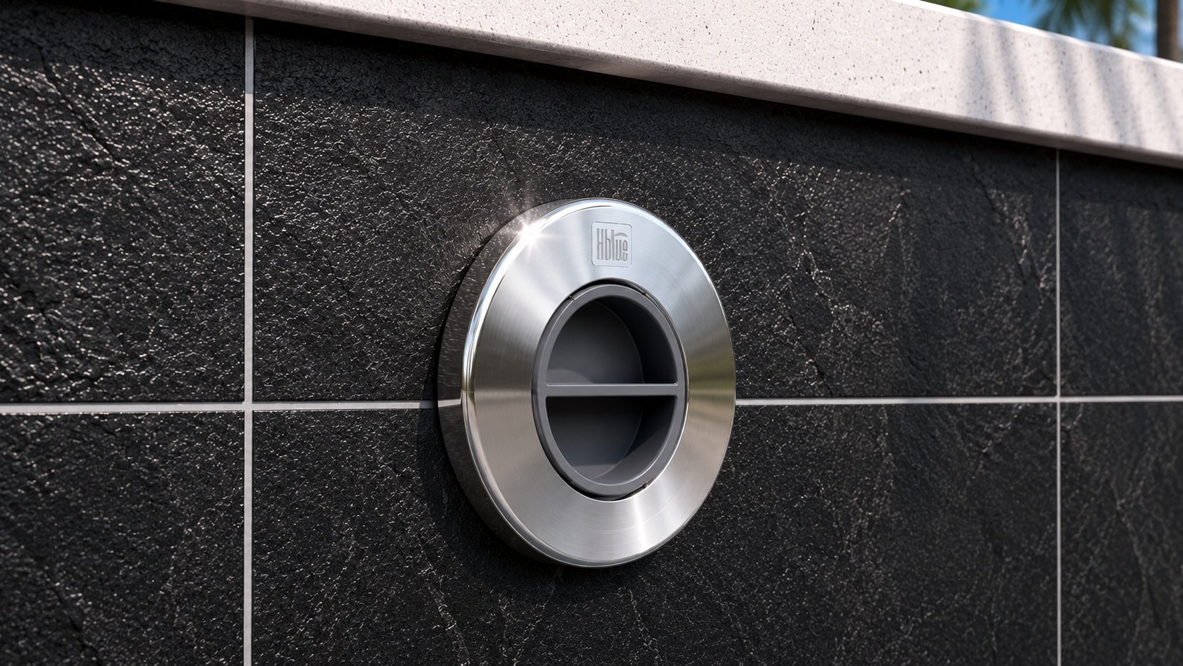Aspiração Max em inox instalada em revestimento de pedra preta